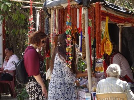 Women tourist in Market, spirituality on sale in Rishikesh
